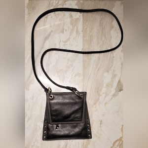 Black Tous leather crossbody bag with silver hardware.